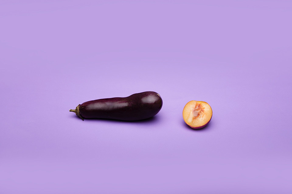 Eggplant and peach on lilac background