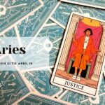 Red and orange tarot card with a dark haired woman sitting on a chair with the word Justice beneath her