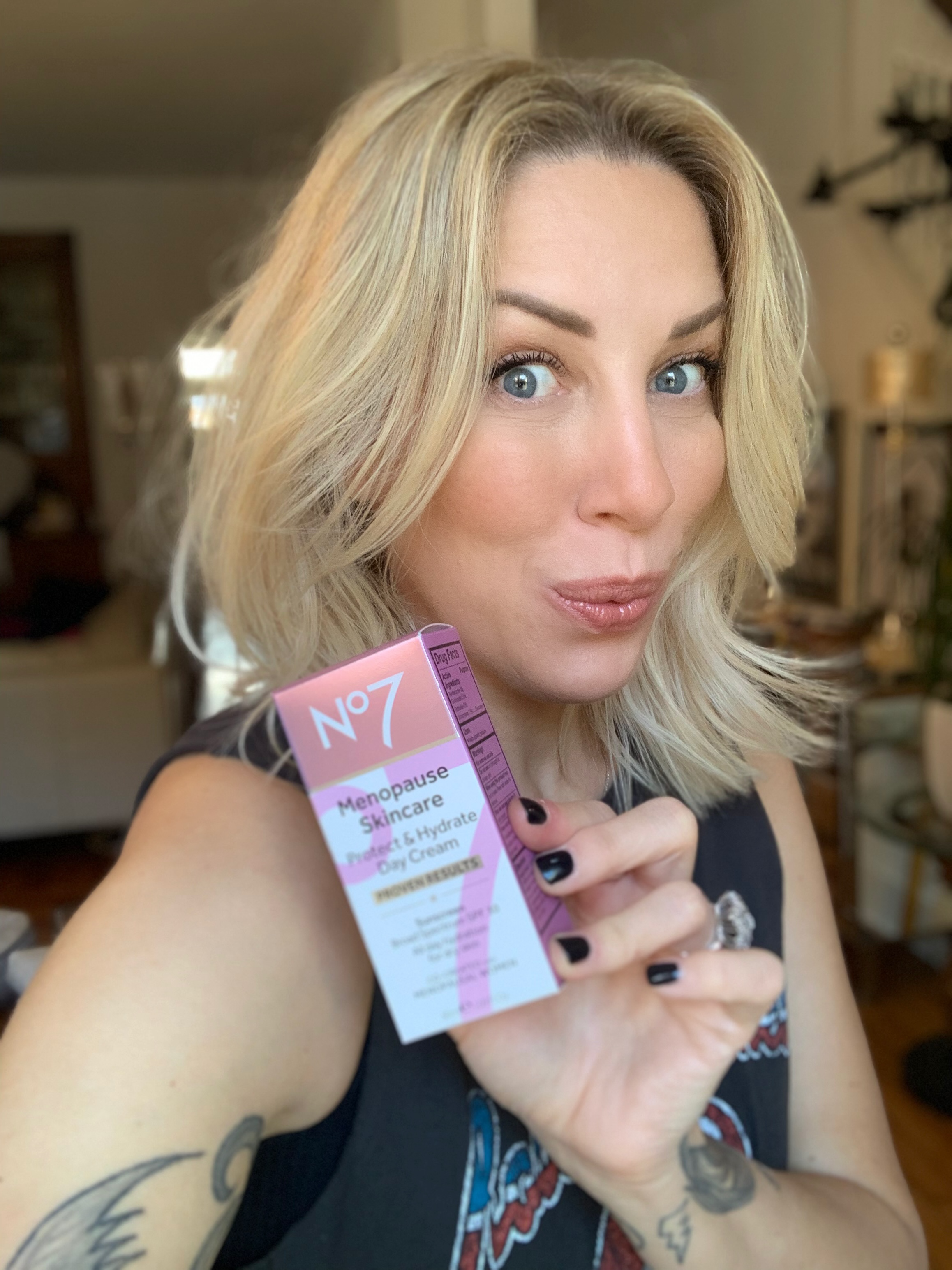 Lauria holding a No7 Menopause product