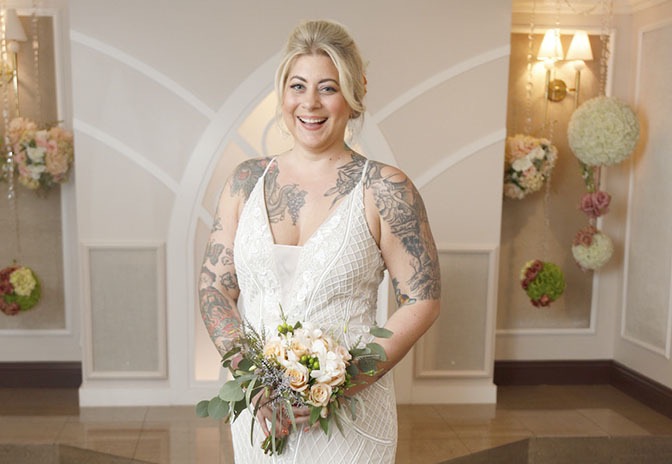 woman in white wedding dress with visible tattoos