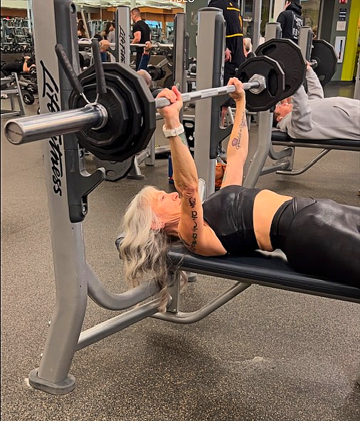Ilene Block of Silver and Strong bench pressing in the gym