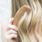 woman combing hair