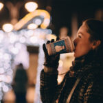 holiday lights woman drinking coffee