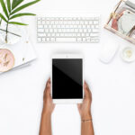 woman holding a blank-slate tablet