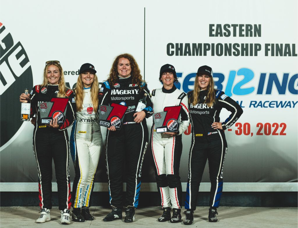 Erin Vogel with women racers at 2022 Eastern Championship Final