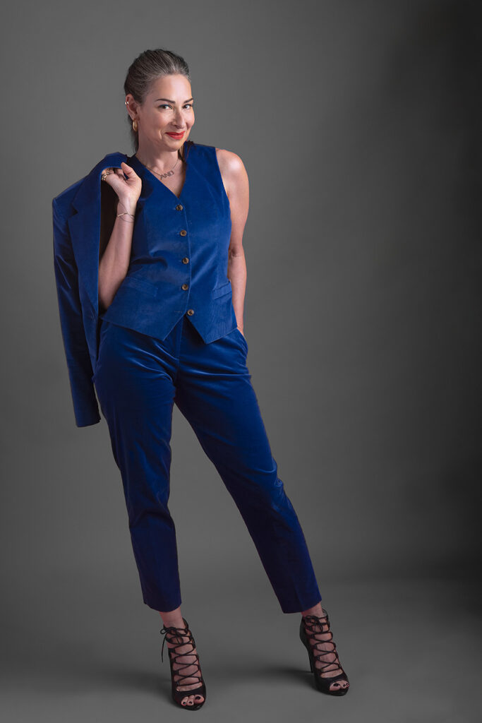 Stacy London wearing a blue velvet suit
