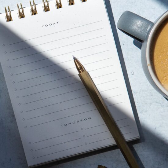 notepad, pencil, and coffee