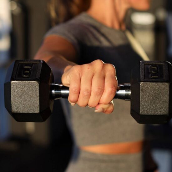 woman holding dumbbell