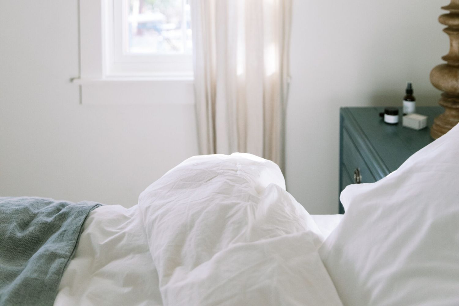 bed with white linens