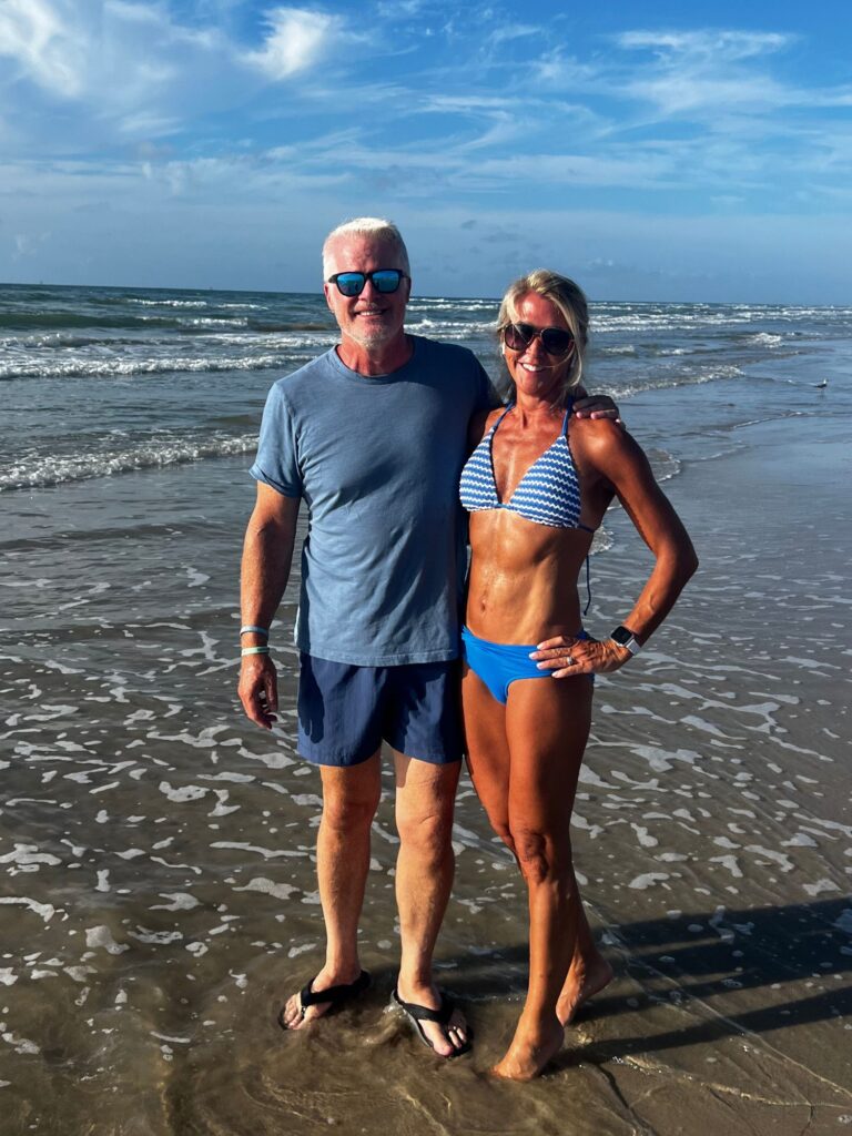 Photo of Bonny Osterhage with her husband on the beach.