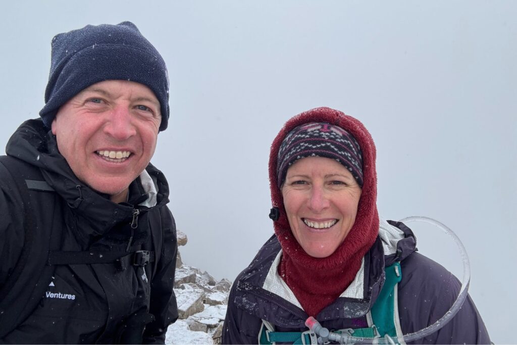 Rebecca Callahan and her husband at the top of Mt. Quandary during a September snow storm