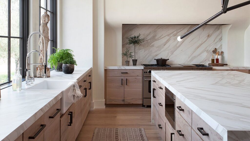 a modern kitchen with marble counters