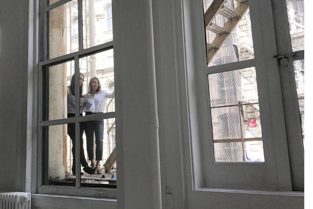 The author, Marni Blank, with her sister on the fire escape outside Blank Studios