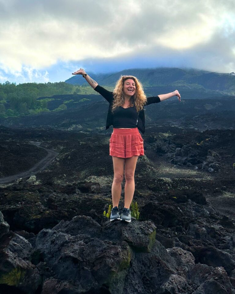 Amie Newman standing on a mountain