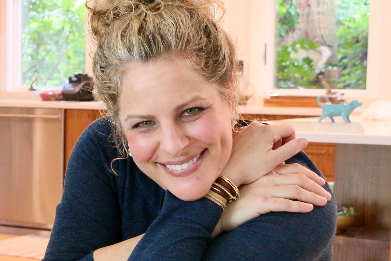 Jill Smokler smiling in her kitchen