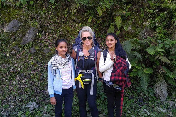 Anissa Buckley on the Anna Purna Circuit near Manang (12,000 feet) with two friendly schoolgirls