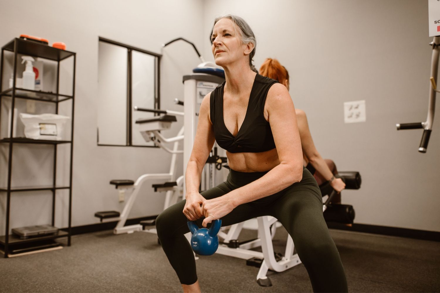 Woman squatting with Kettlebell